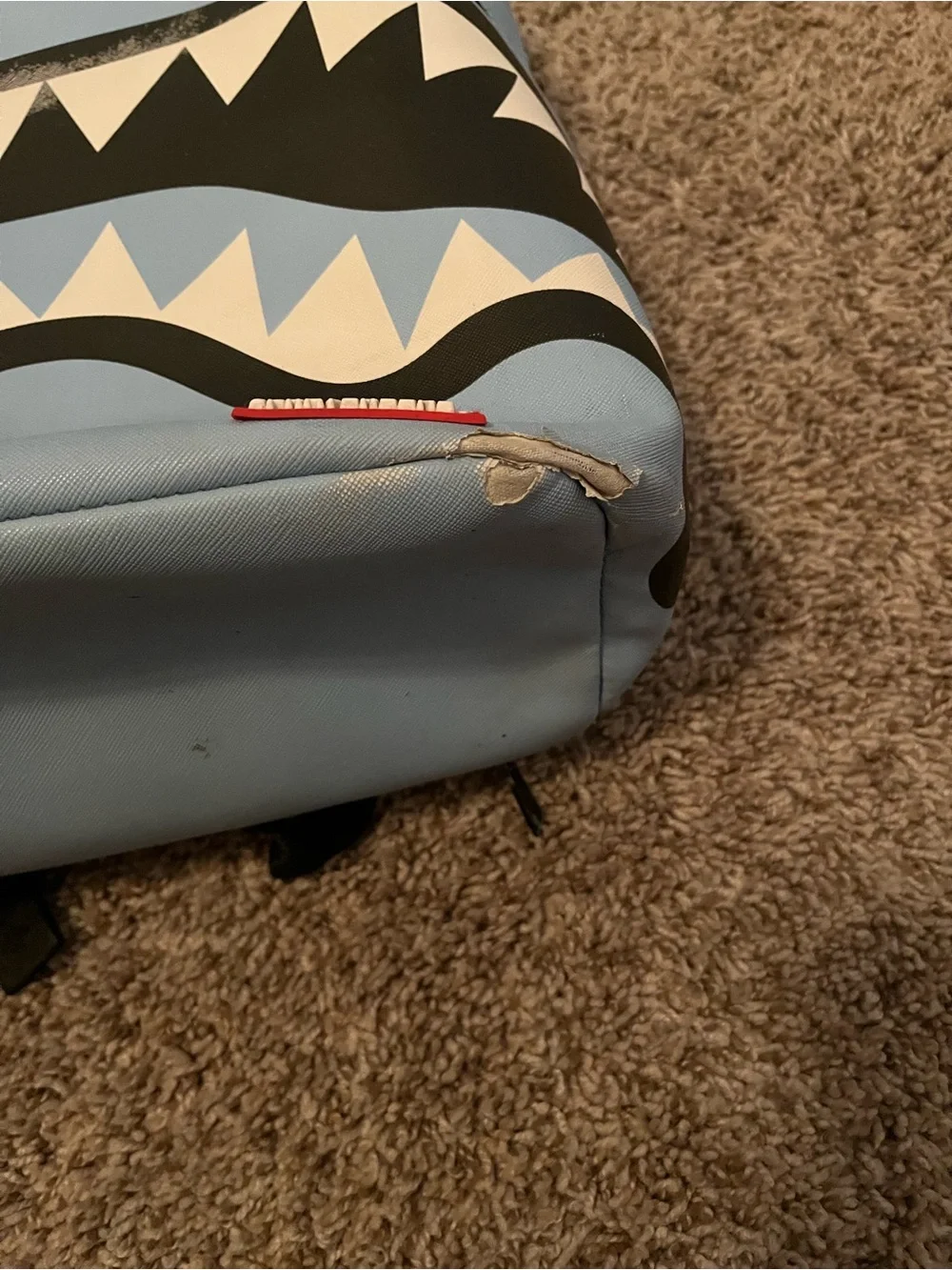 Sprayground Light Blue Backpack.